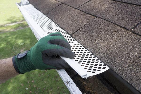 gutter guards help to prevent debris from clogging gutters, such as mesh, nylon, aluminum, and brush guards